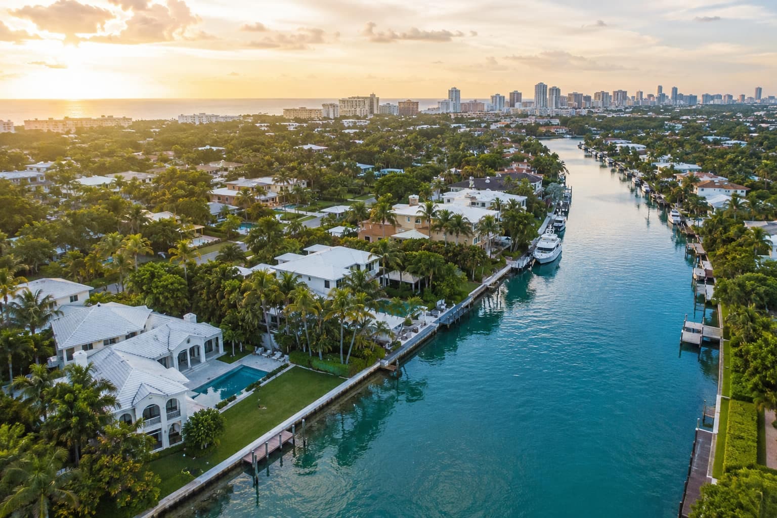 Aerial view of a waterfront neighborhood at golden hour
