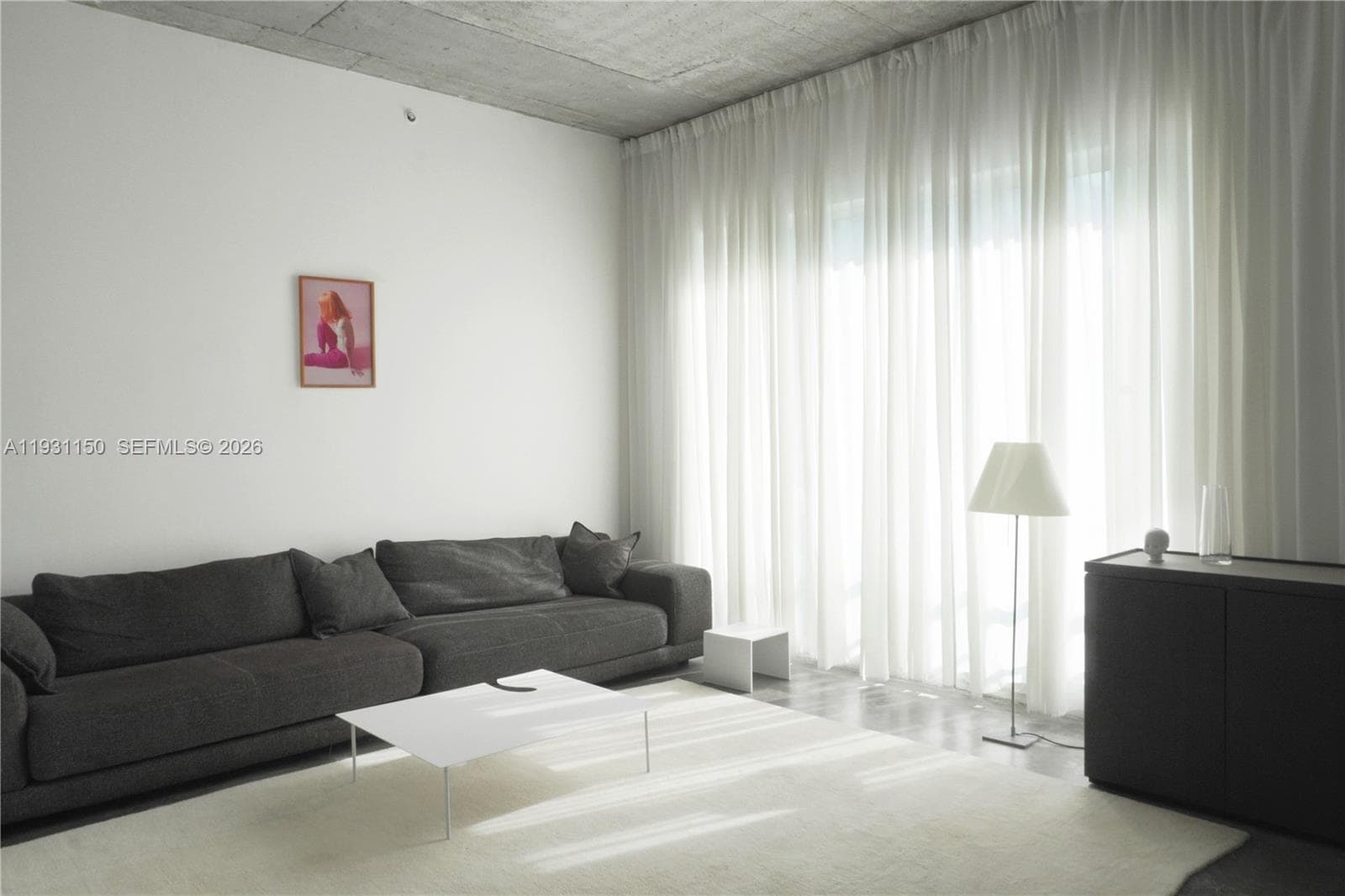 Bright and cozy living room - furnished with high-end design pieces.