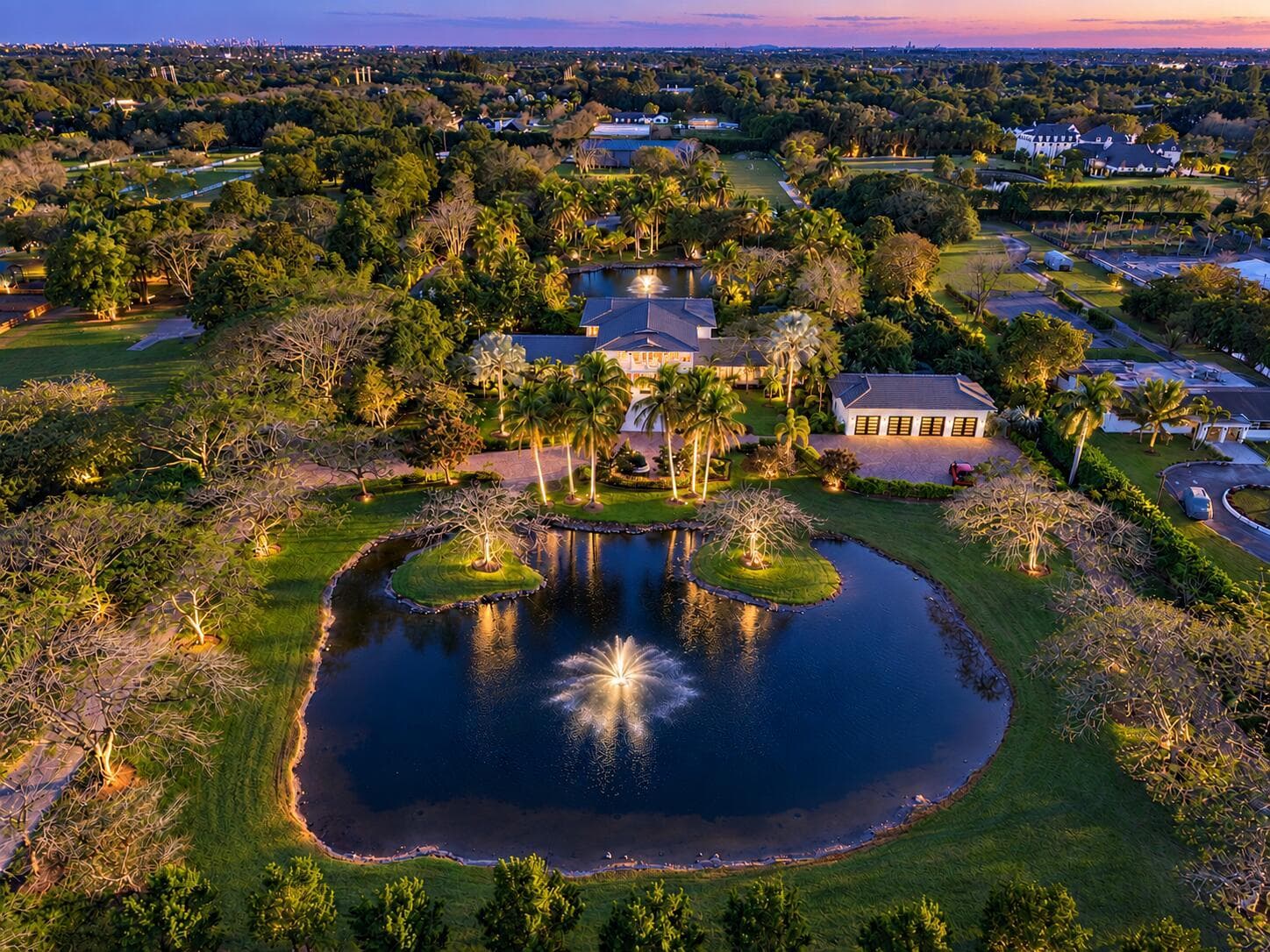 Twilight estate with fountains and trees