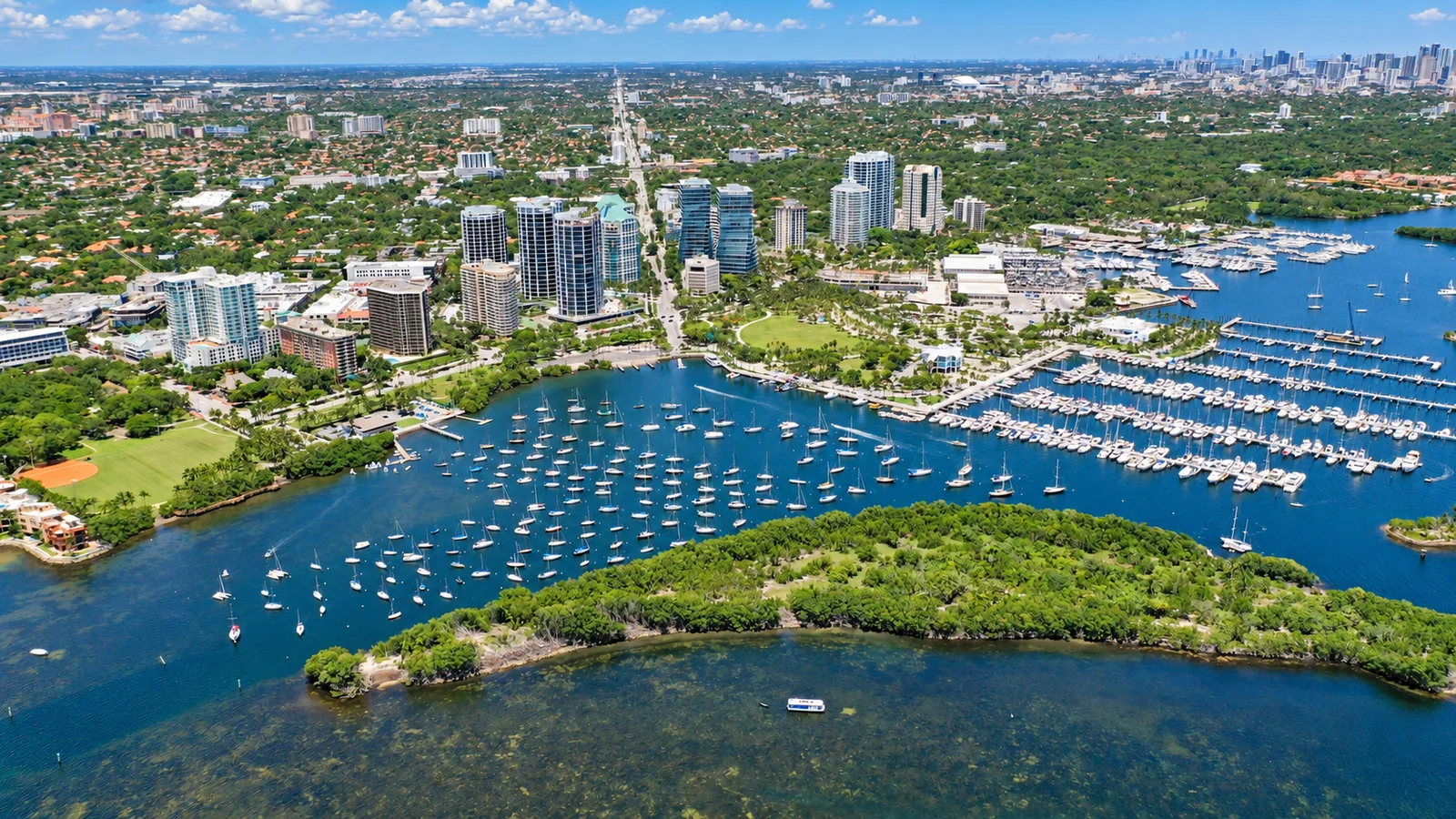 Daylight aerial scene of Coconut Grove, Dinner Key Marina and Biscayne Bay in Miami
