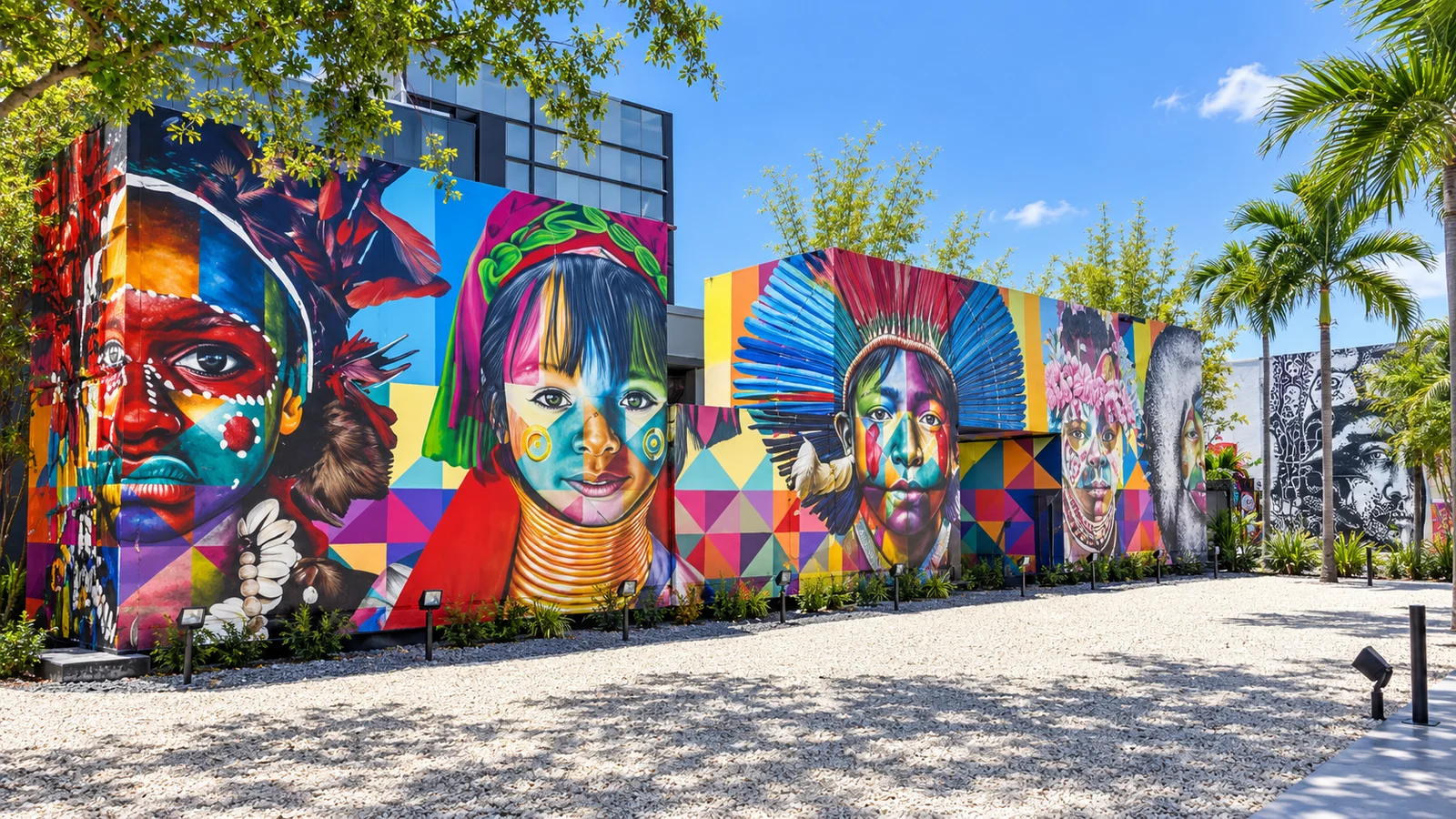 Colorful indigenous portrait murals in an empty Wynwood Walls courtyard